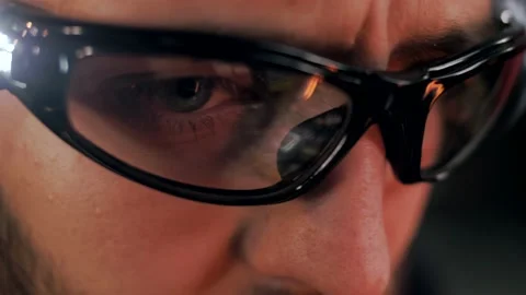 The man works in glasses with a built-in flashlight and illumination. Stock Footage 151646174