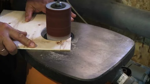 A man works on a grinding machine Stock Footage 132238917