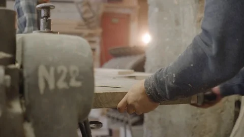 Man Works on Hand Jack-Plane in Wood Workshop Stock Footage 107913344
