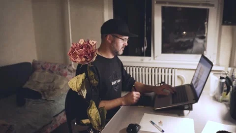 A man works at home on a computer 4K Stock Footage 325988443