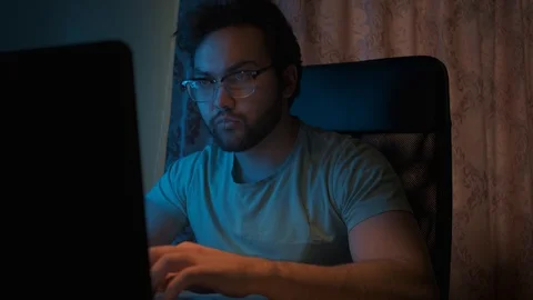 A man works at home at a computer during self-isolation due to quarantine. Stock Footage
