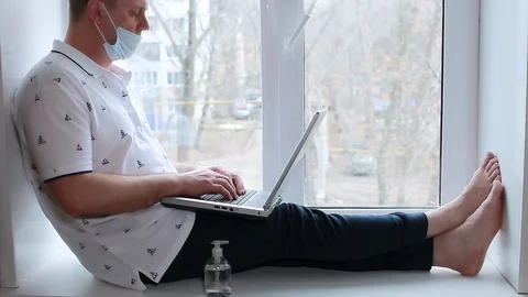 A man works at home on a computer Stock Footage 128002508