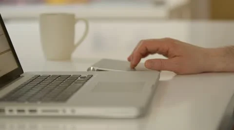 Man works from home using laptop and  track pad Stock Footage 22228410