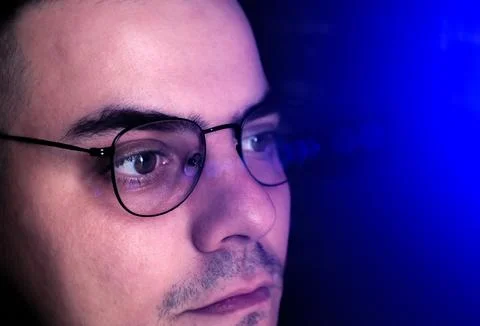 Man works on internet. Reflection at the glasses from laptop..Close up of m.. Stock Photos