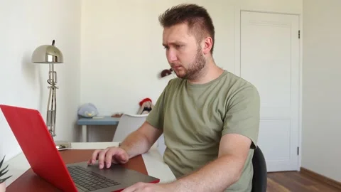 Man works on laptop, executes an order, enters a message, thinks about an order Stock Footage 156905730