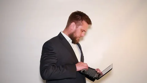 A man works on a laptop Stock Footage 90839552