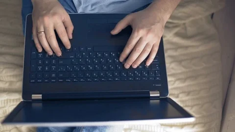 A man works on a laptop, a freelancer develops new goals Stock Footage 104262806