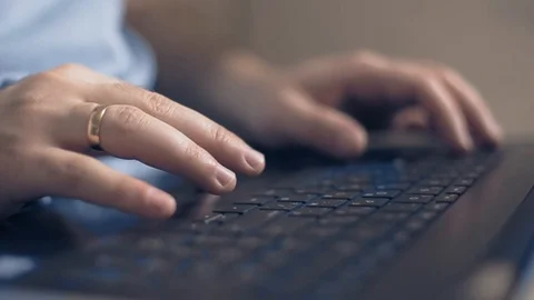 A man works on a laptop, a freelancer develops new goals 動画素材 105322187