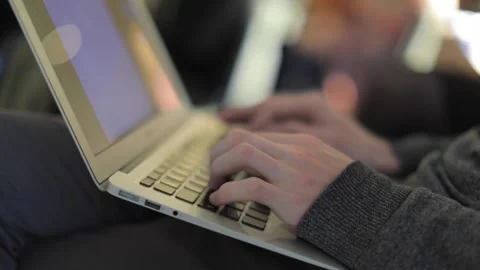 A man works on a laptop at his computer. Prints an important document Vídeo Stock 144466398
