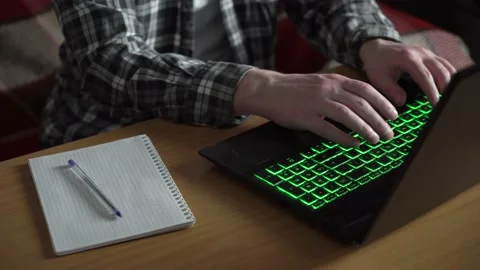 A man works at a laptop. notebook on the table. Stock Footage 236690041