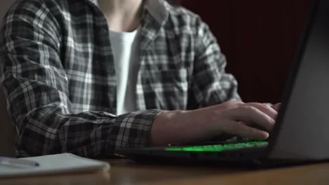 A man works at a laptop. notebook on the table. close-up Stock Footage 236690156