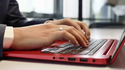 A man works on a laptop in the office. Stock Footage