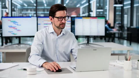 Man Works On Laptop Planning Project Schedule Stock Footage 333847565