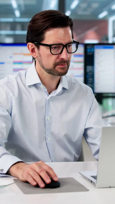 Man Works On Laptop Planning Project Schedule Stock Footage 334931664