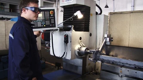 Man works on a milling machine Stock Footage 91238824