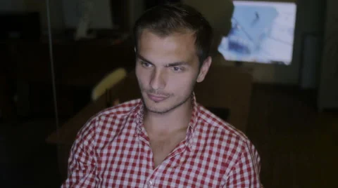 The man works at night to complete the plan for construction of the house Stock Footage 58014139