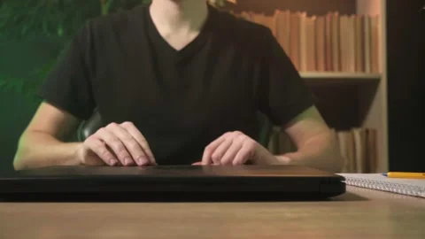 A man works in the office at a computer, a guy works at a computer at home Stock Footage 264131167