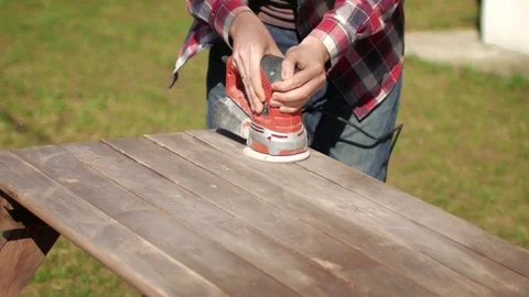 A man works, polishes a table 스톡 동영상 90925997