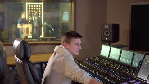 A man works in a recording studio Video stock 104077034