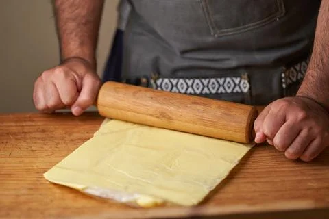 Man works with a rolling pin 스톡 사진