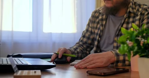 Man works seamlessly on laptop, exploring innovation with advanced apps, letting Stock Footage 301524256