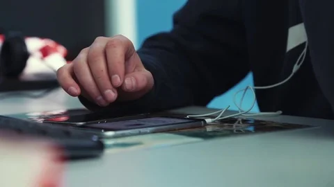 A man works on a smartphone Stock Footage 76000085