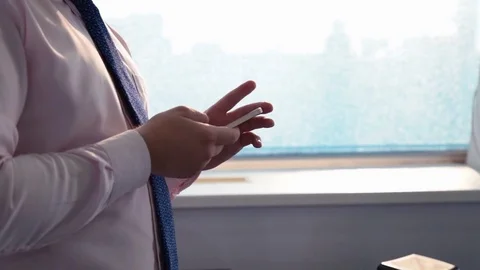 A man works on a smartphone Stock Footage 76000281