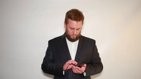 A man works with a smartphone Stock Footage 90839554
