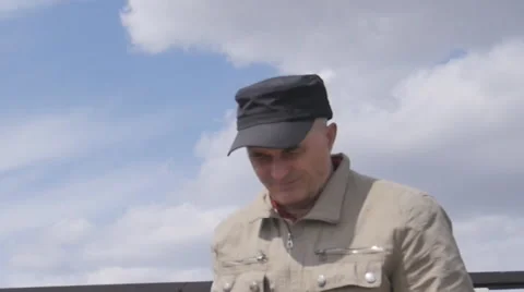 A man works on the tablet on a background of clouds Stock Footage 63300887