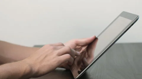 Man Works on Tablet at Black Desk Stock Footage 50487591