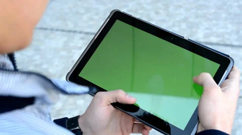 Man works at the tablet (green screen) on the street Stock Footage 37202103