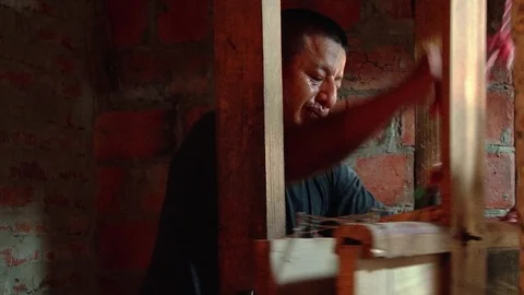 Man works on treadle loom at workshop in Montecristi, Ecuador Stock Footage 88815249