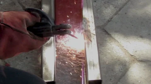 Man works with welding carbon worker welds metal welding machine. Stock Footage 159484211
