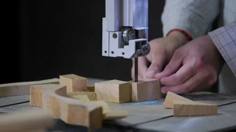 A man works with wood in a workshop. Working with wooden blanks. A man drills Video stock 294716703