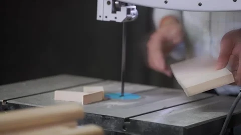 A man works with wood in a workshop. Working with wooden blanks. A man drills Stock-Footage 296682452