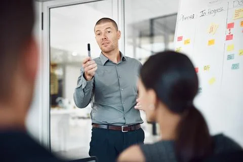 Man, workshop and sticky notes on whiteboard for advice, timeline and employee Stock Photos