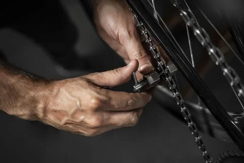 Man in workshop creating bike Stock Photos