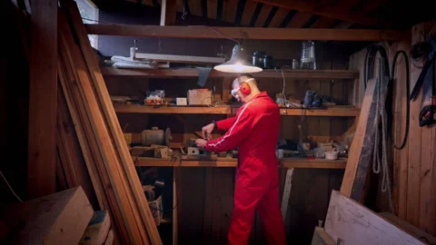 A man in a workshop uses a vice. Stock Footage 318586845