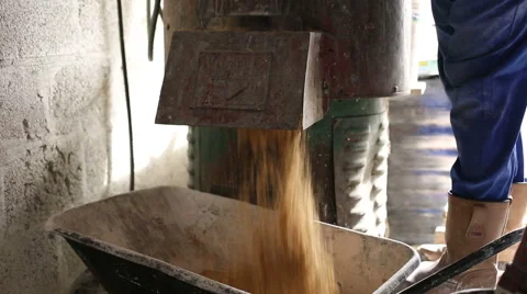 Man in workshop using mixer to mix sand to be used for casting Stock Footage 58641403