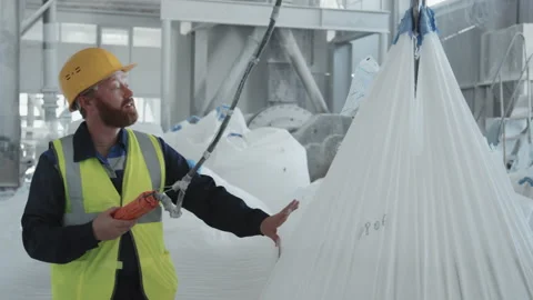 Man In Workwear Using Lifting Hoist | Stock Video | Pond5