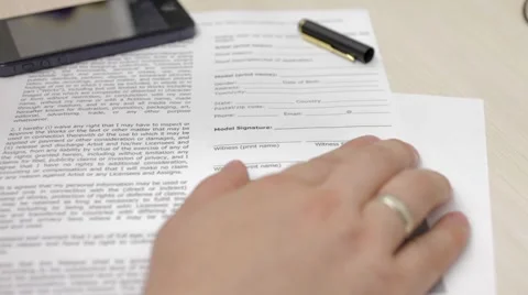 A man is worried before signing a document Stock Footage 54354641