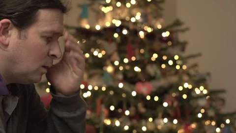 Man worries about debt at Christmas Time Stock Footage 88409474