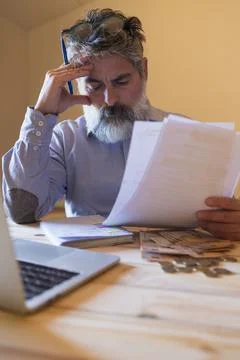 Man worrying about financial problems and managing debt 스톡 사진