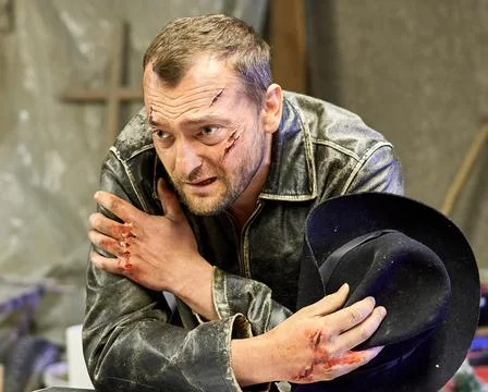 A man with wounds in the hat Stock Photos