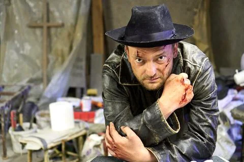 A man with wounds in the hat Stock Photos