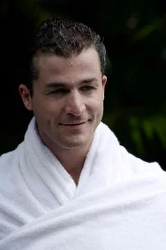 Man wrapped in towel Stock Photos