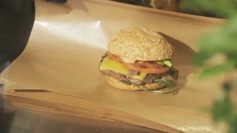 Man Wrapping a Burger Stock Footage 71563922