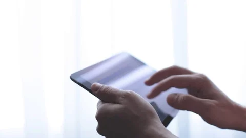 Man write and send email on tablet. window background Stock Footage 93304780