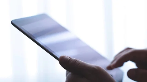 Man write and send email on tablet. window background Stock Footage 93305312