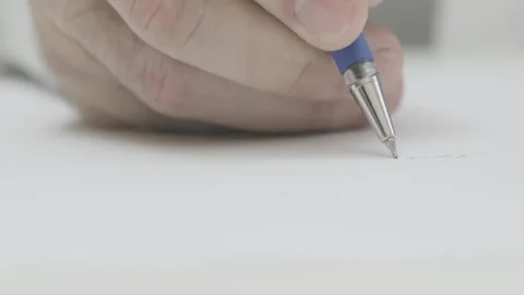 Man write with ballpoint pen on white sheet of paper close-up Video stock 265878378
